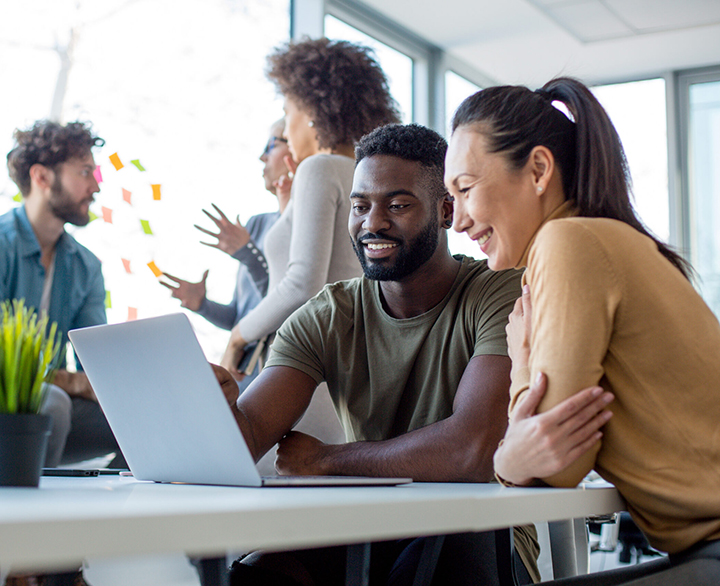 coworkers collaborating at a desk