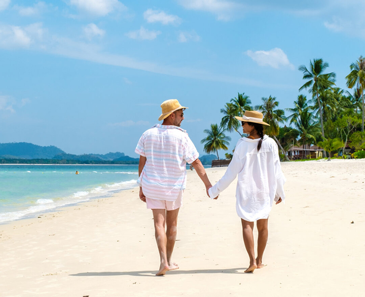 couple walking along a beach