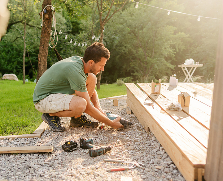 man working on a deck build