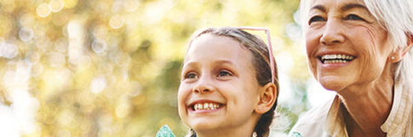 girl and grandma smiling