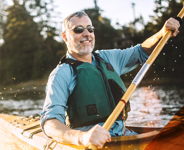 older man kayaking