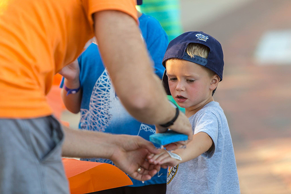 young boy getting a temporary tattoo at a Verve event booth