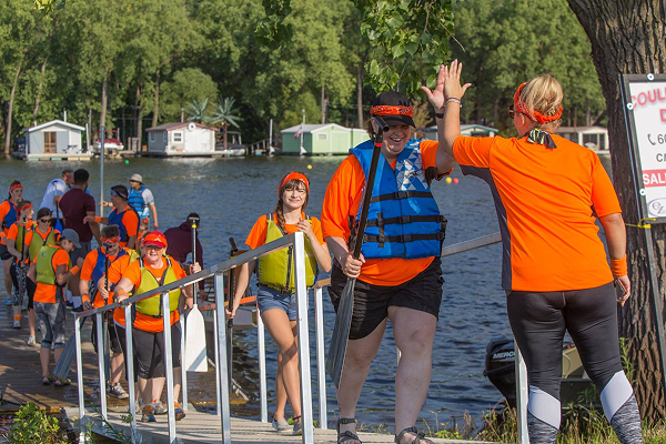 Verve kayak team high-fiving