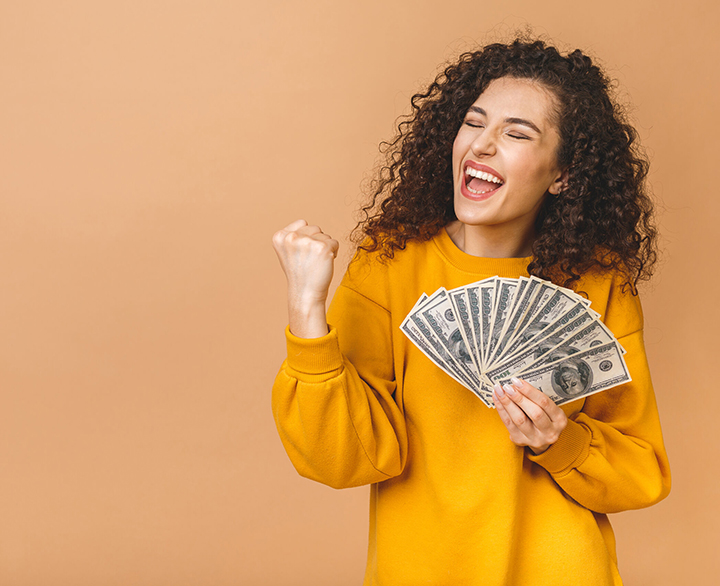 woman holding a cash fan