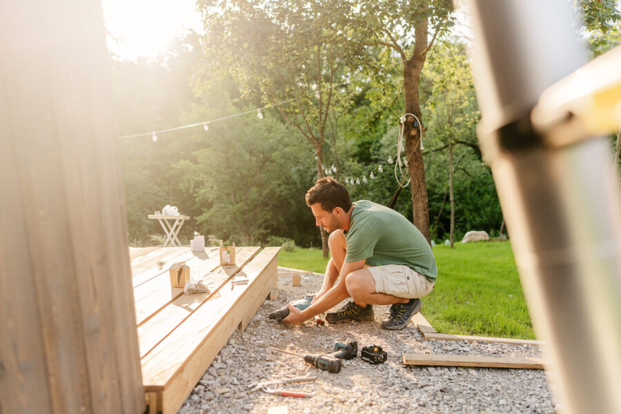 home maintenance help and money etiquette, backyard deck being built